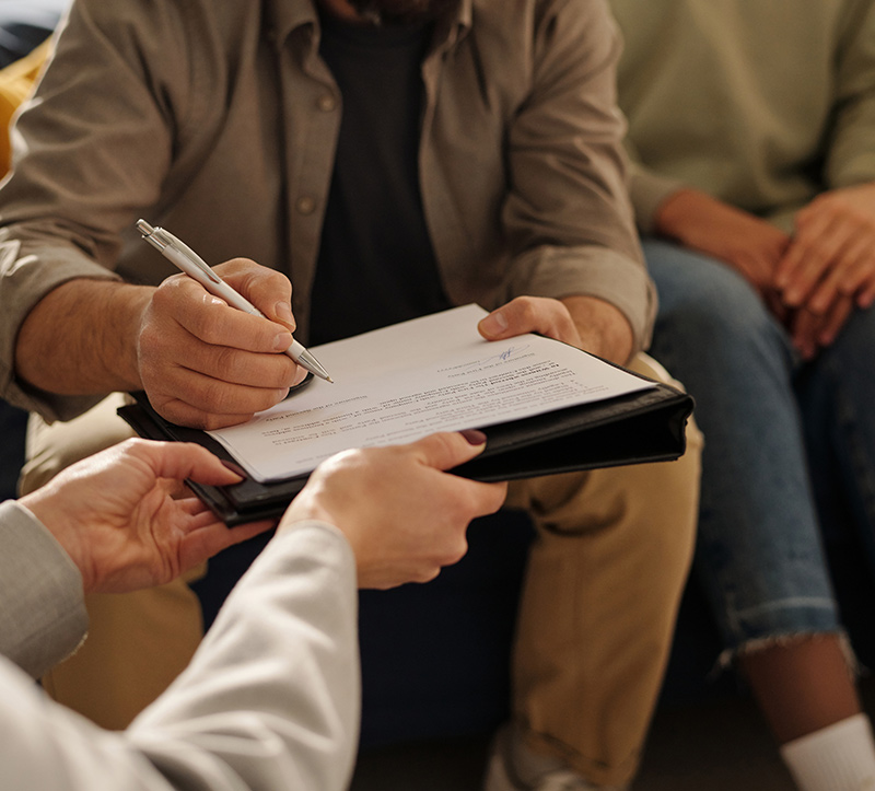 Man signing a legal documnent
